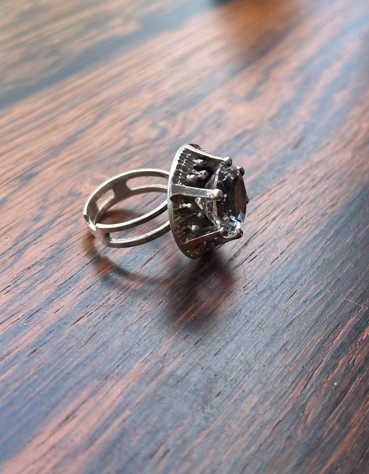 Silver ring with a large cut rock crystal